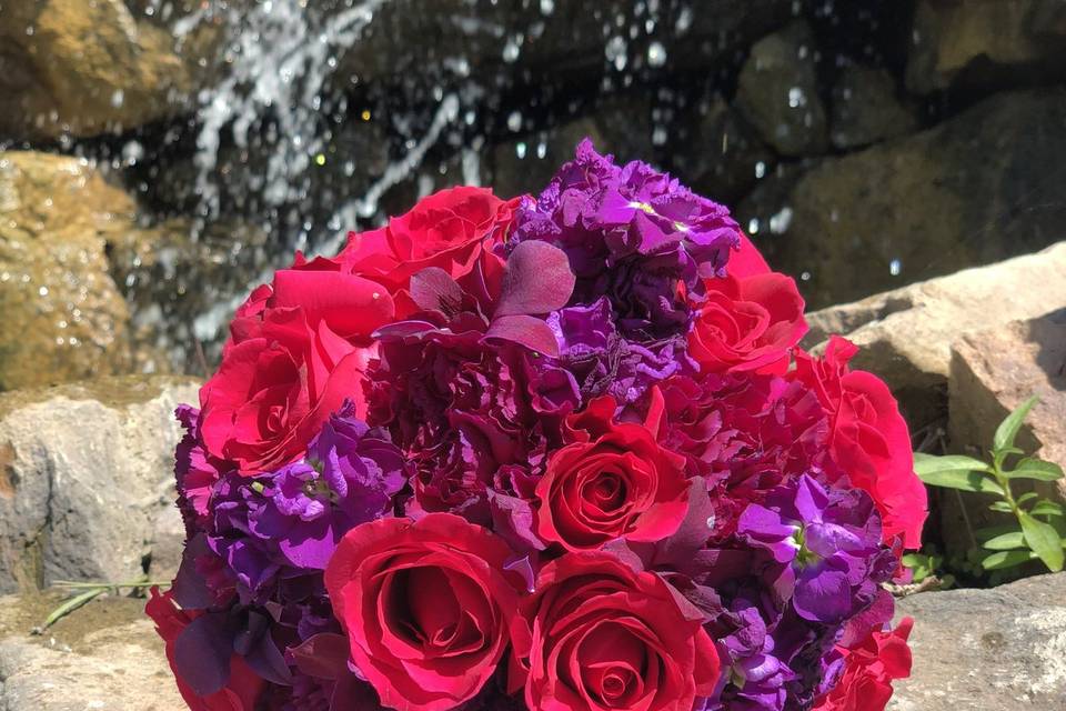 Dark pink roses, purple stock, pink orchids at Stonebrook Golf