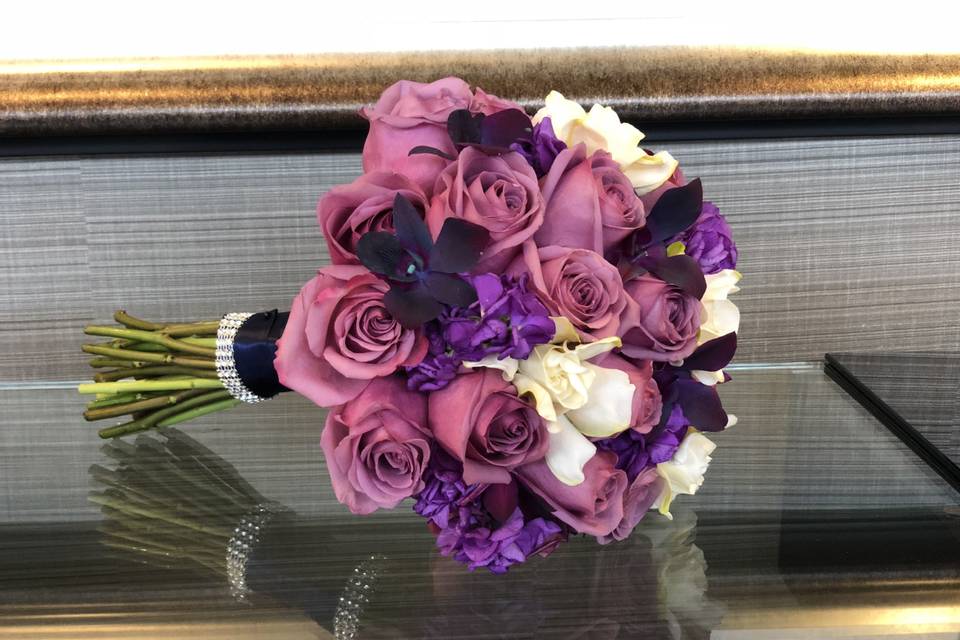 Lavender roses, purple orchids, purple stock, white gardenias at Courtyard Minneapolis