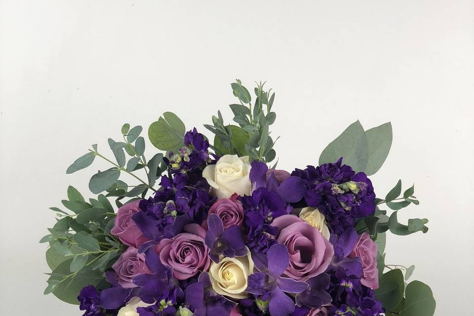 Lavender roses, purple stock, orchids, eucalyptus