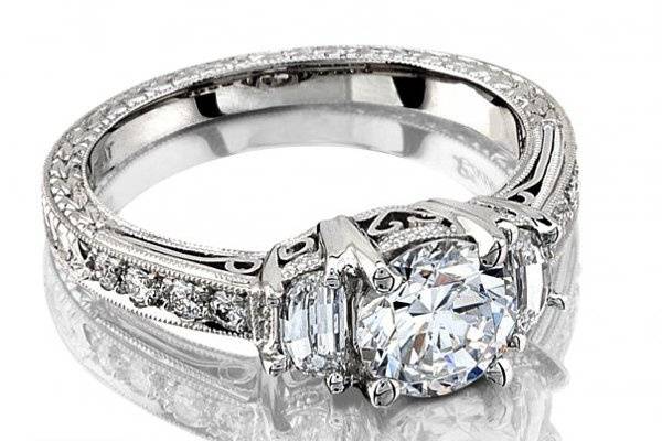 Round Brilliant Diamond Engagement Ring with Half Moon Side Diamonds. The Piece is Hand Engraved with a Pave Diamond Shank.