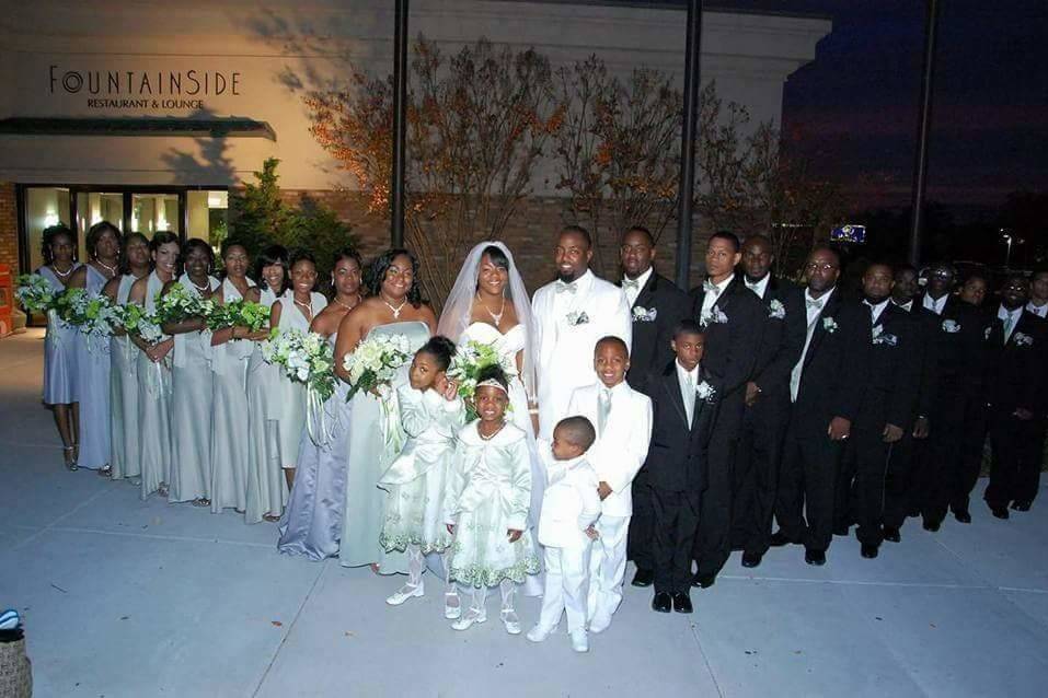 The couple with the bridesmaids and groomsmen