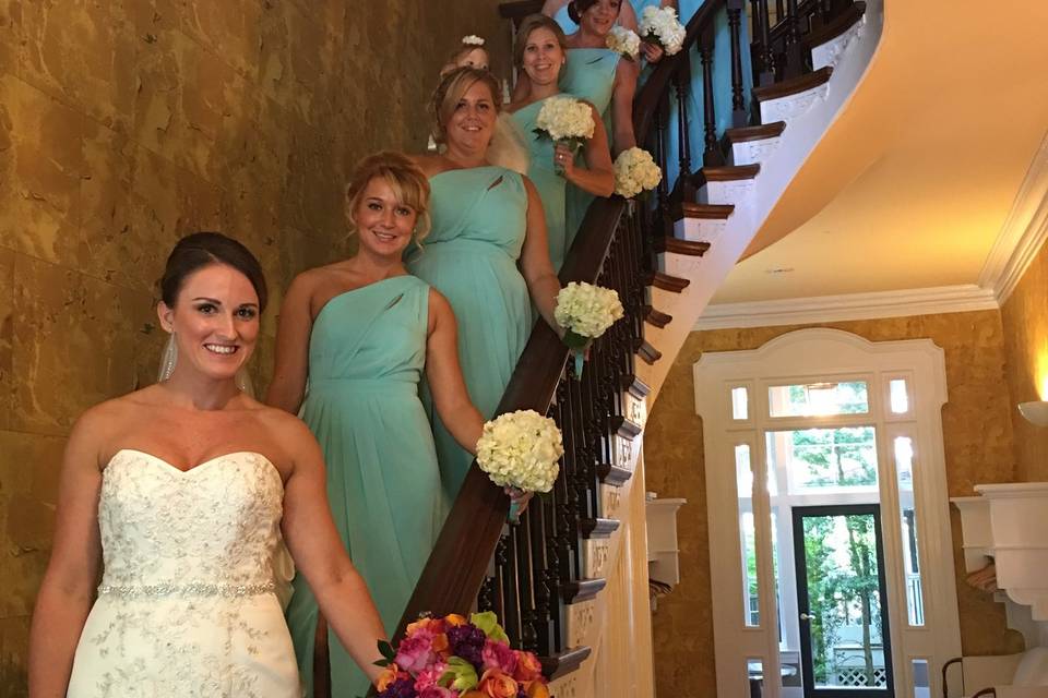 Bride and bridesmaids on the stairs