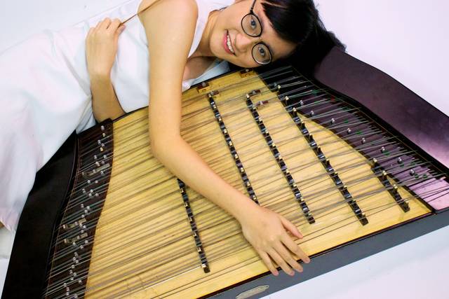 With the dulcimer