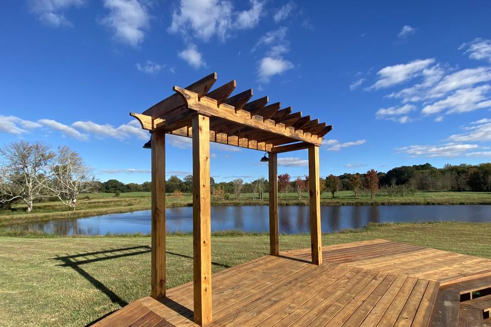 Deck and Arbor next to pond