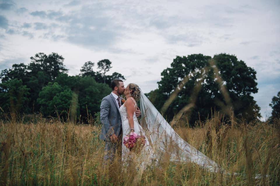 Couple with tall grasses