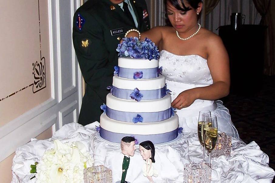 Couple slicing their cake