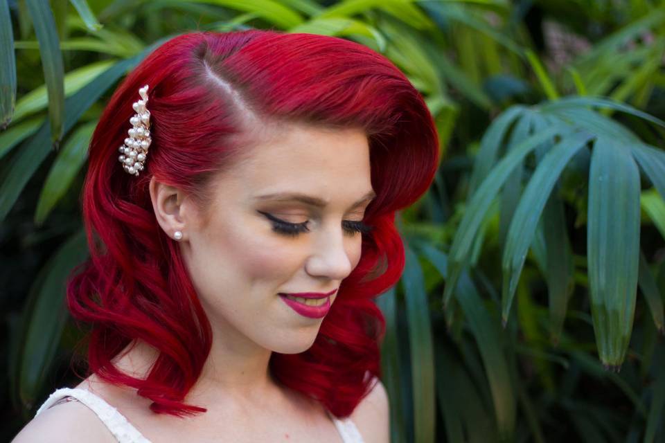 Red haired bride with white flower bouquet