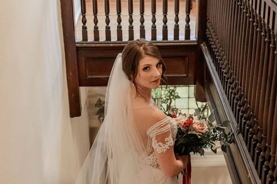 Top of staircase with bride
