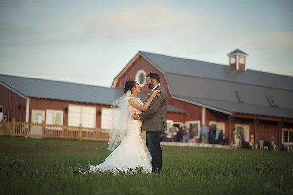 Bride and groom outside the barn