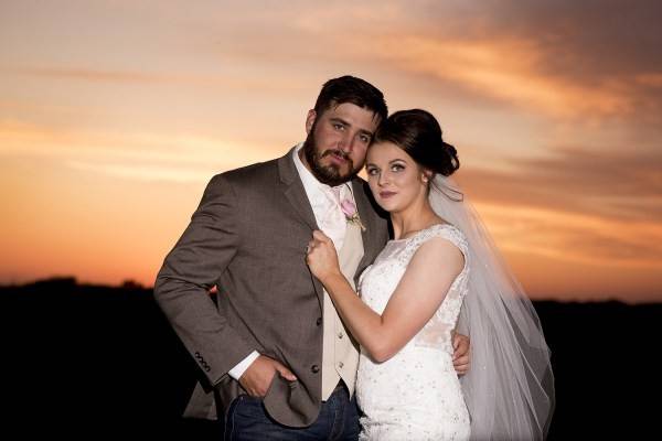 Newlyweds during sunset