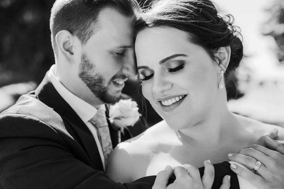 Groom hugging his bride