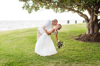 The newlyweds kissing