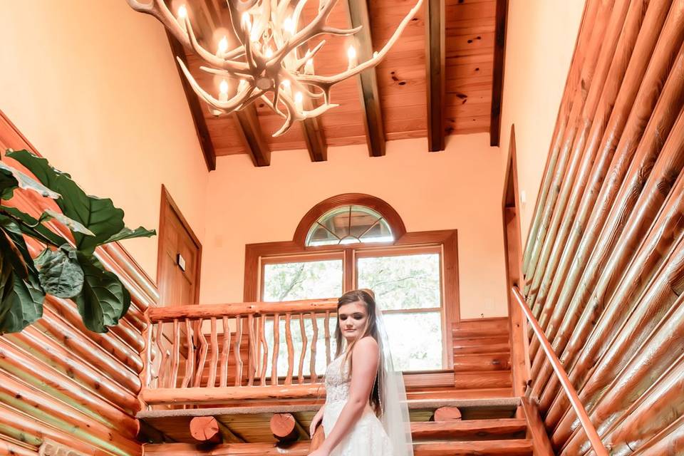 Bride on stairs in Antler Hall