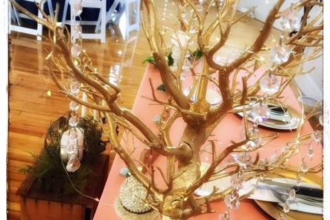 Gold Trees dripping with crystals and fairy lights add a subtle shimmer.