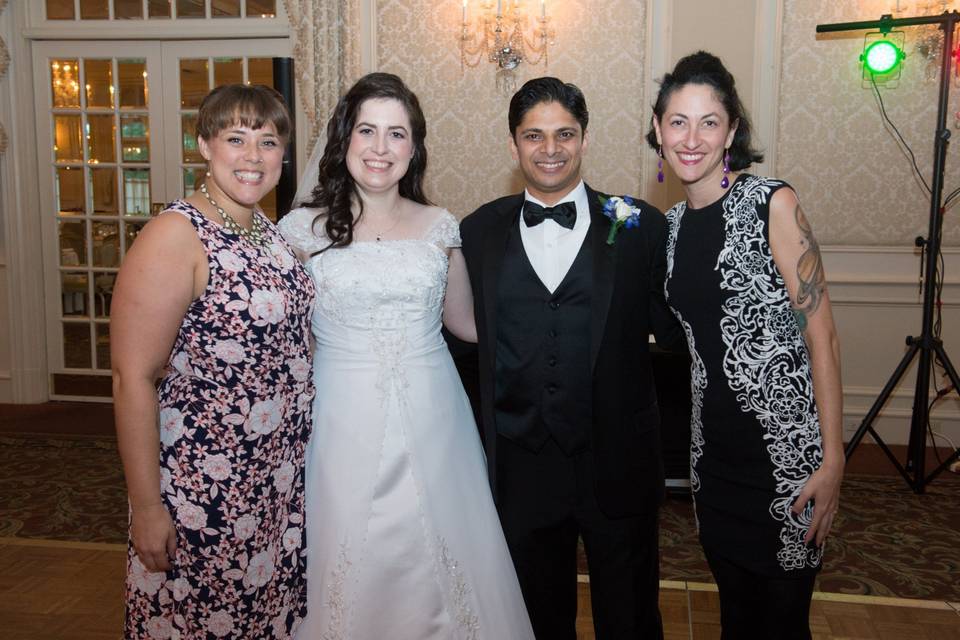 Posing with the bride & groom