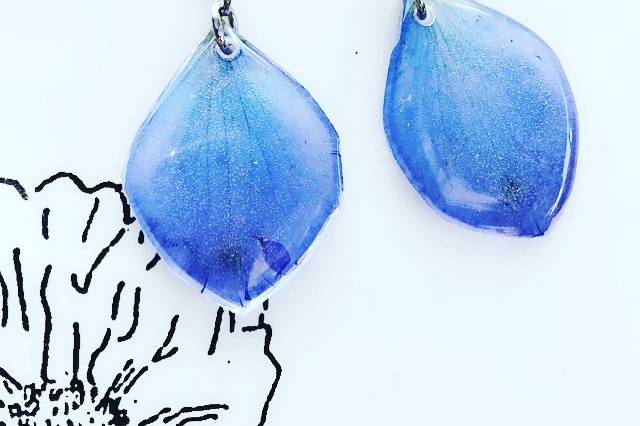 Earrings made from delphiniums