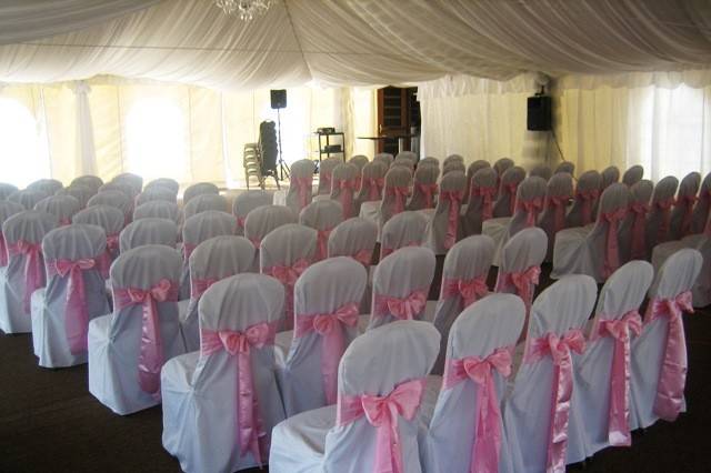 Pink sashes on ceremony chairs