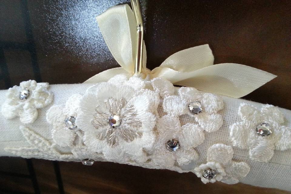 Hand embellished padded wedding gown hanger.  Embellished with ivory appliques, silver metallic threads, and rhinestones. Hanger is heavy duty!, fully padded, 17