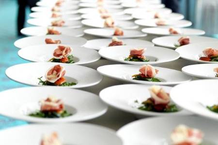 Parma Ham with baby aragula, caramelized macademia nuts, balsamic reduction, raspberry champagne vinaigrette, for 500 guests.