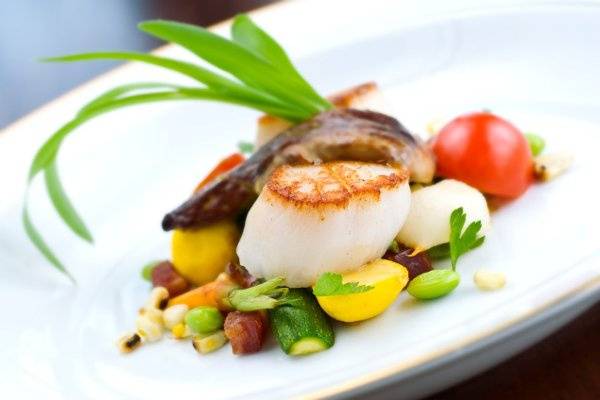 Seared scallops French Vanilla bean sauce, vegetable timbale.