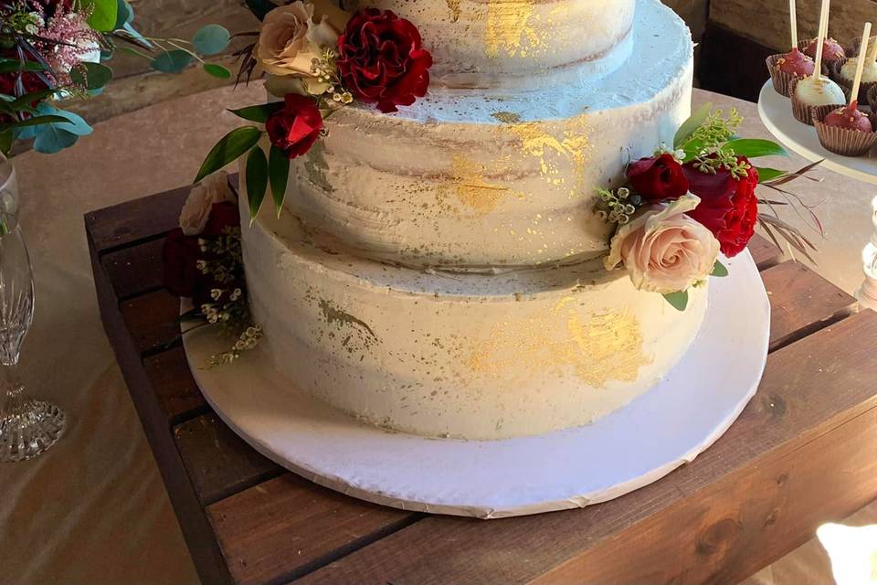 Four tier naked cake with gold