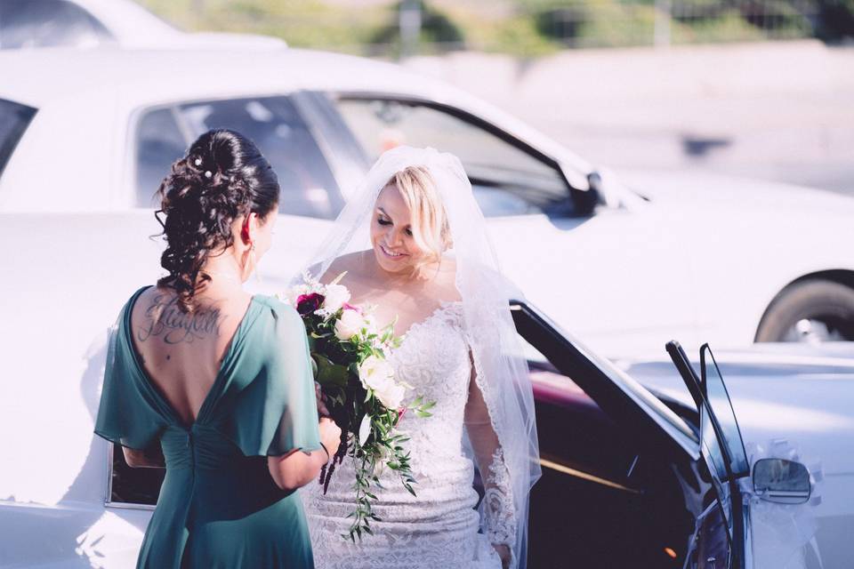 Bride and bridesmaid with bouquet