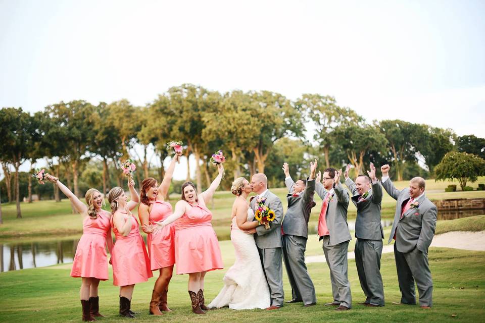 The couple with the bridesmaids and groomsmen