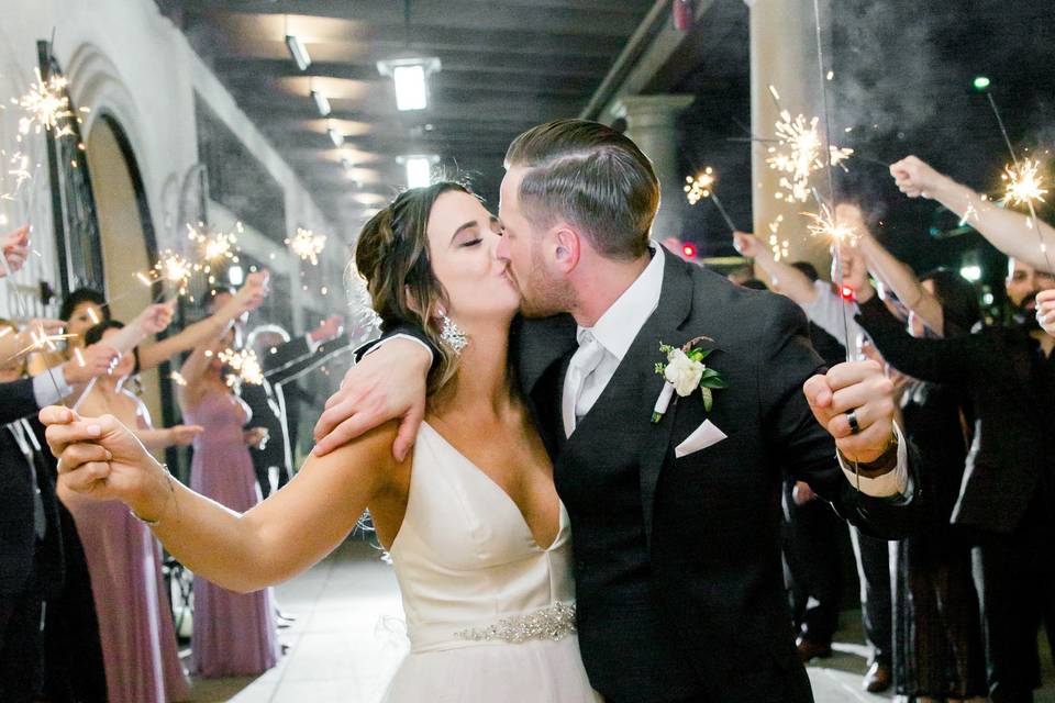 Couple kissing with sparklers