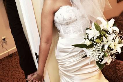 Groom bride hold hands