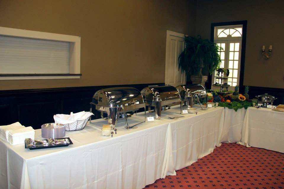 A Closer look of one side of the buffet table.  This table held the Brisket, Rice Dressing and Fried Fish.   Bread Rolls were provided for the Brisket with Mayo and Mustard options and Tauter Sauce provided for the Fried Fish.   Wedding Reception located at Rip Van Winkle Gardens, New Iberia, LA.