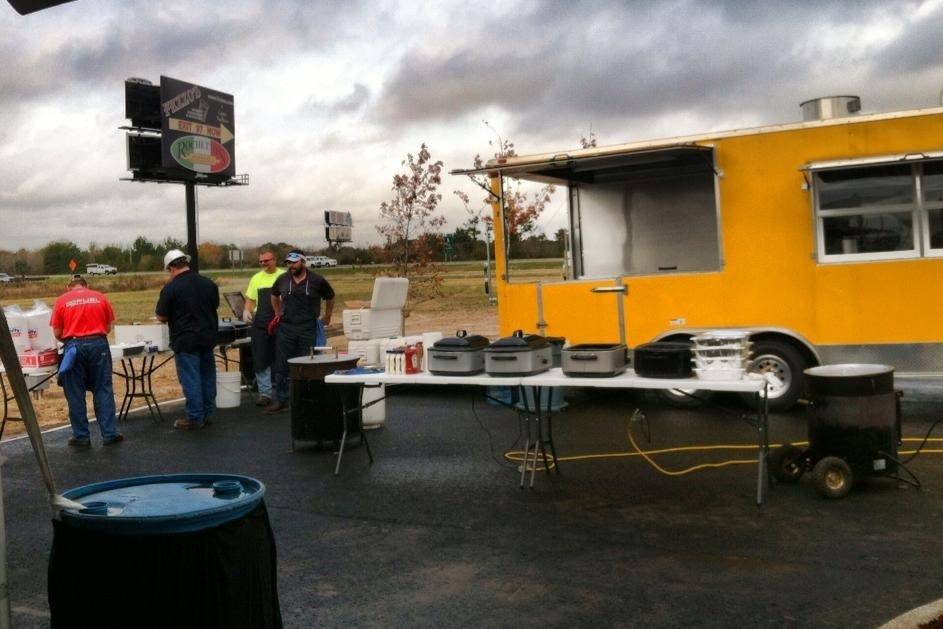 Cajun Commander Catering cooking Crawfish Etouffee and Fried Fish to serve 300 guests attending the Hoover Tank Grand Opening in Scott, LA.