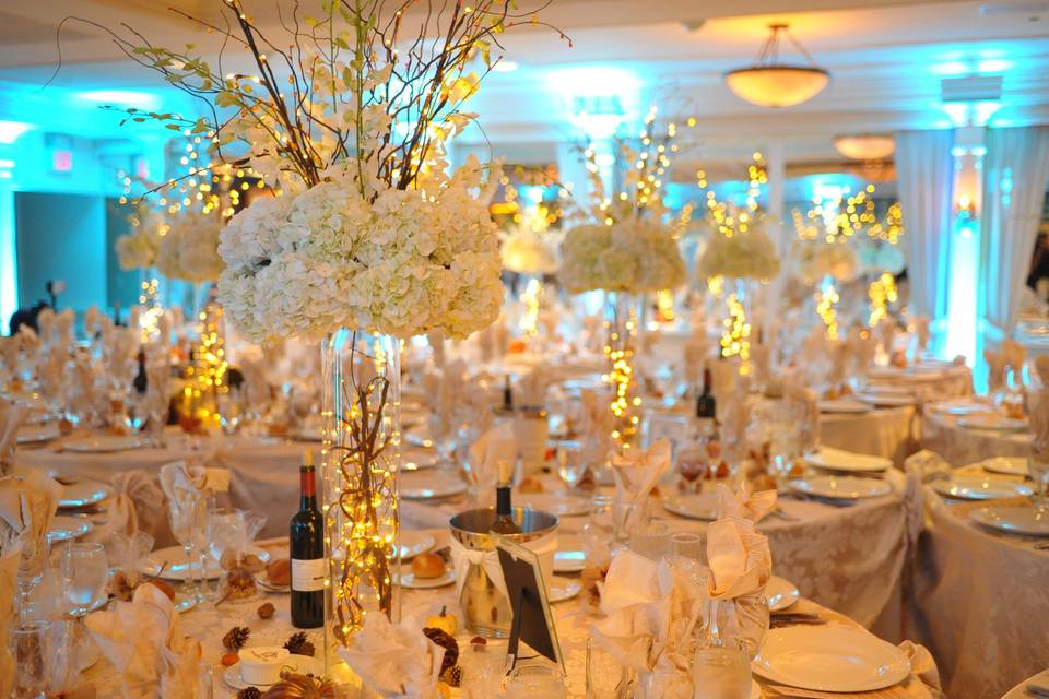 Table setup with white flower centerpiece