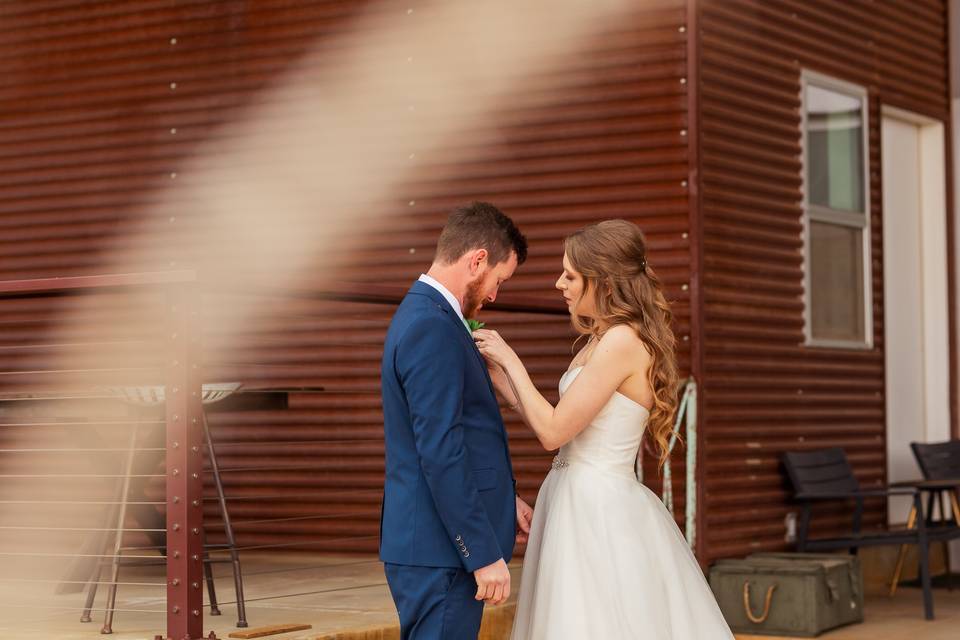 Fixing his tie