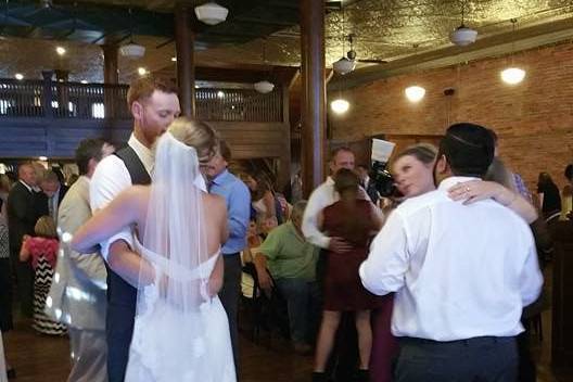 Couple and guests dancing