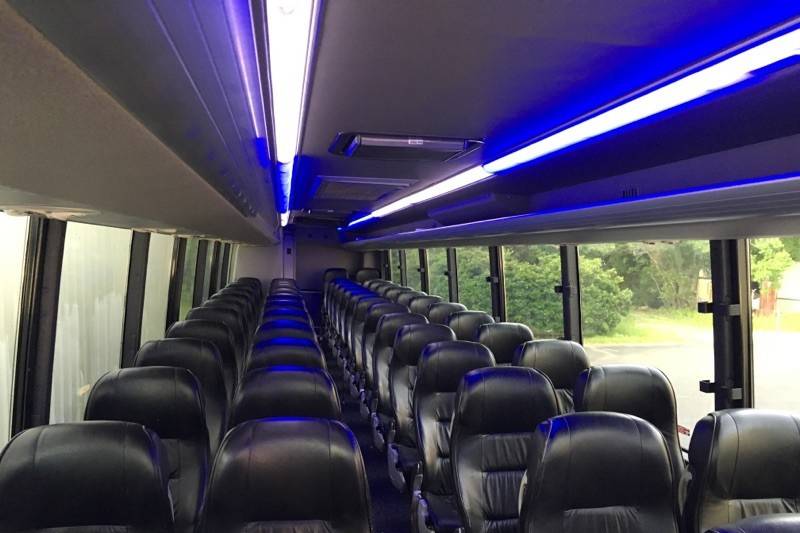 56 Passenger Motor Coach Bus with Black Leather Interior Seating