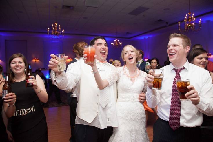 Couple and guests dancing