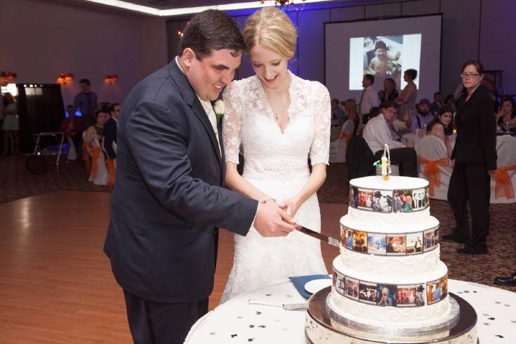 Couple cut 3 layered wedding cake
