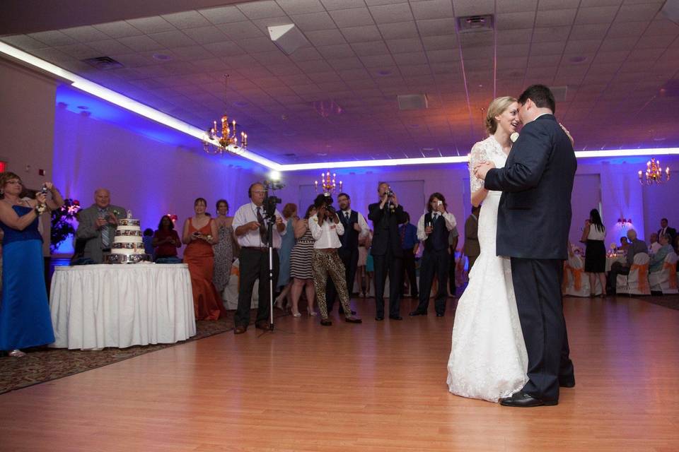 Couple cut 3 layered wedding cake