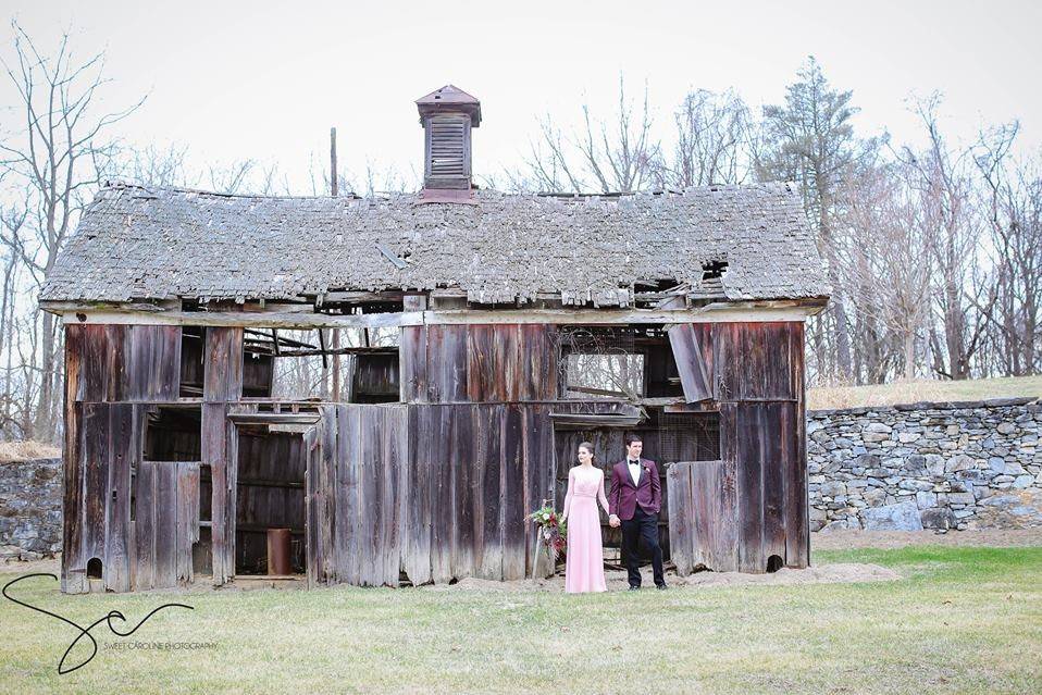 Couple by a rickety barn