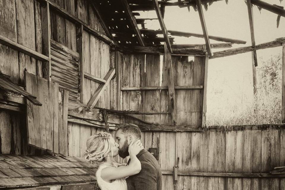 Couple kiss in a chicken coop