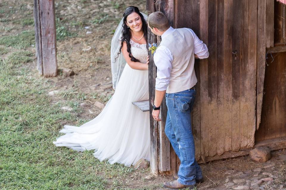 Couple kiss in a chicken coop