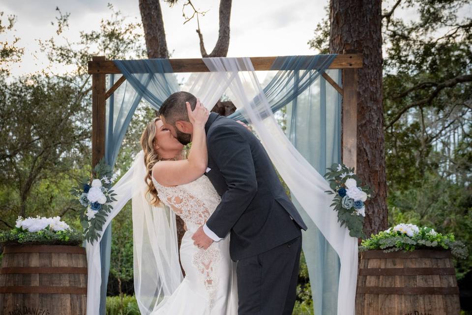 Bride and Groom sharing a kiss