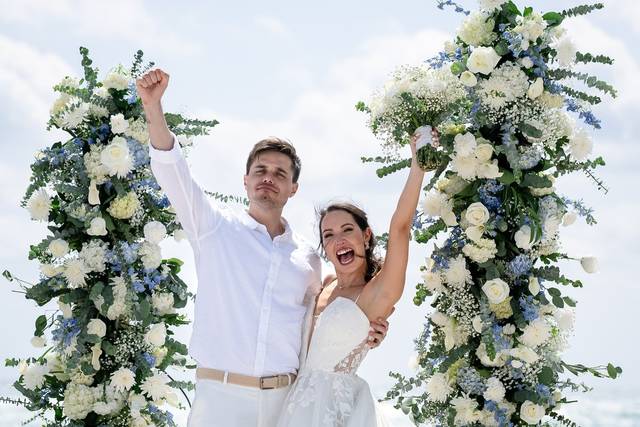 Wedding under floral arch