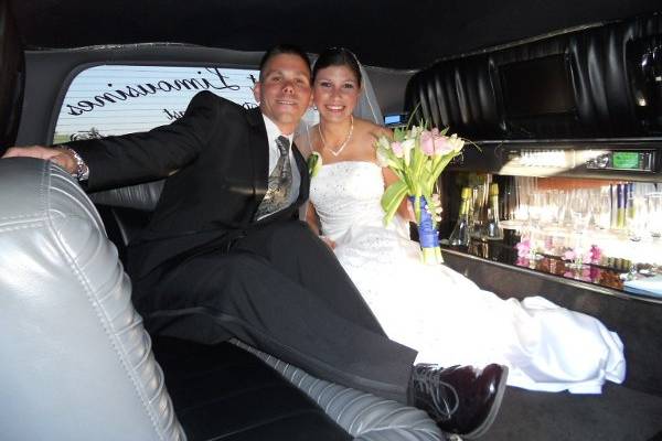 Bride and Groom In Our 20 Passenger Excursion Limo's  VIP Section. After Their Wedding In Jacksonville
