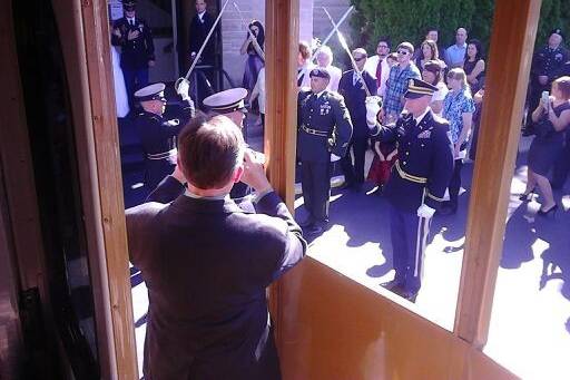 Soldiers honoring the newlyweds