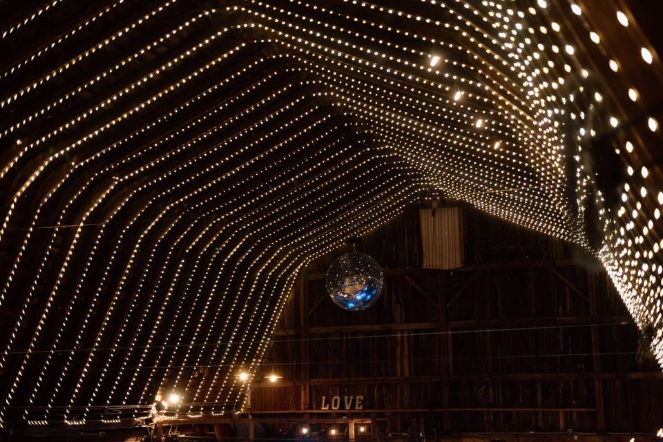 Barn rafters, lit at night