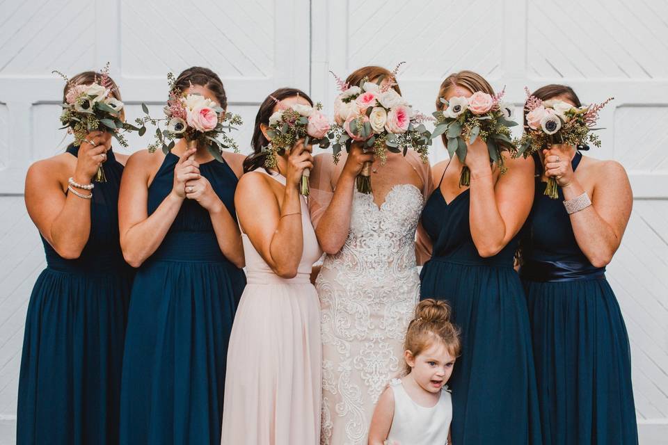 Bride and bridesmaids with bouquets - photo by JAS Weddings
