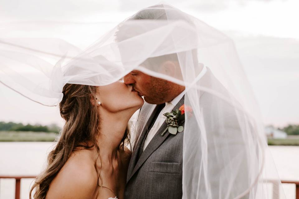 Bride posing with a fresh bouquet of flowers