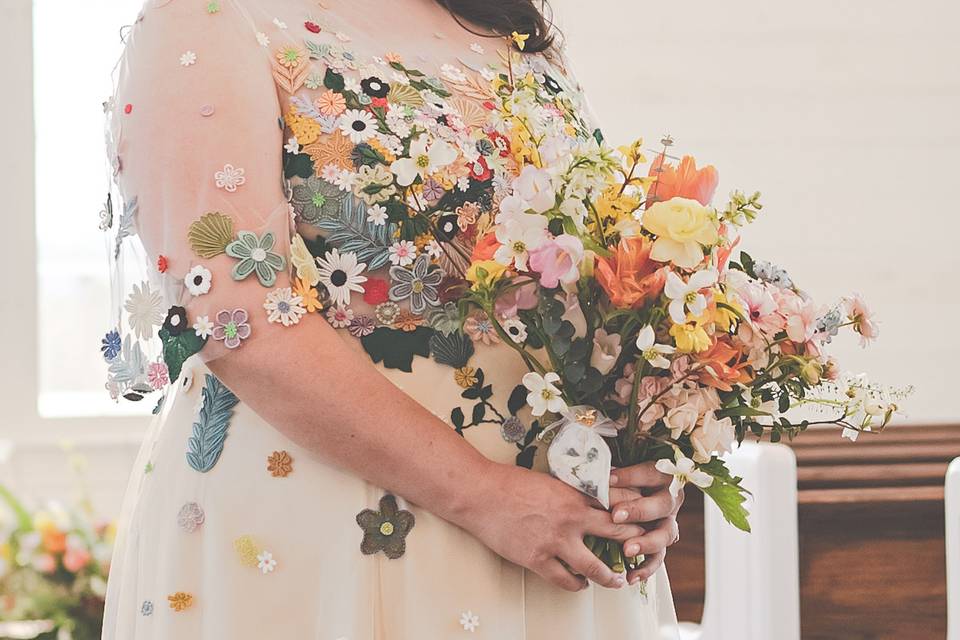 Detail of bouquet and gown