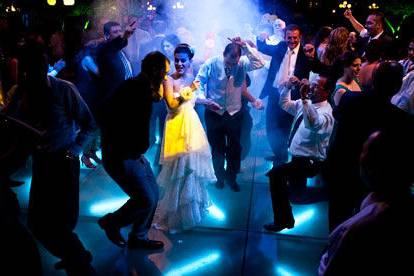 Newlyweds and their guests dancing